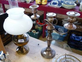 A brass oil lamp with chimney and opaque glass shade - sold with a three branch silver plated