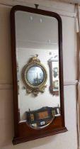 An early 20th Century mahogany framed wall mirror with shaped bevelled plate - from a cheval mirror