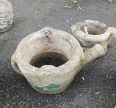 A large concrete planter in the form of a watering can - sold with another in the form of a boot