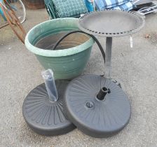 Two plastic parasol bases, a large plastic pot, a similar birdbath and an air pump