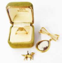 A 375 (9ct.) gold ring with heart shaped panel - size O 1/2 - boxed - sold with a 9ct. pierced bow