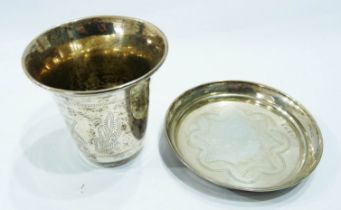 A silver kiddush beaker and shallow dish with simple engraved star of David and scalloped decoration