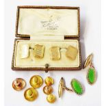 A cased pair of vintage 9ct. gold panel cufflinks with engine turned decoration - sold with