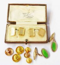 A cased pair of vintage 9ct. gold panel cufflinks with engine turned decoration - sold with