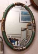 A reproduction French style bevelled oval salon wall mirror with green and parcel gilt border