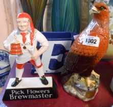 A vintage Carlton Ware pottery Flowers Brewmaster advertising figure, a Beswick Beneagles Scotch