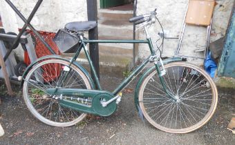 A vintage Raleigh Superbe bicycle in green colourway