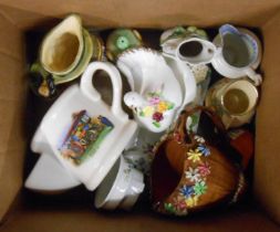 A box containing a small quantity of decorative ceramics