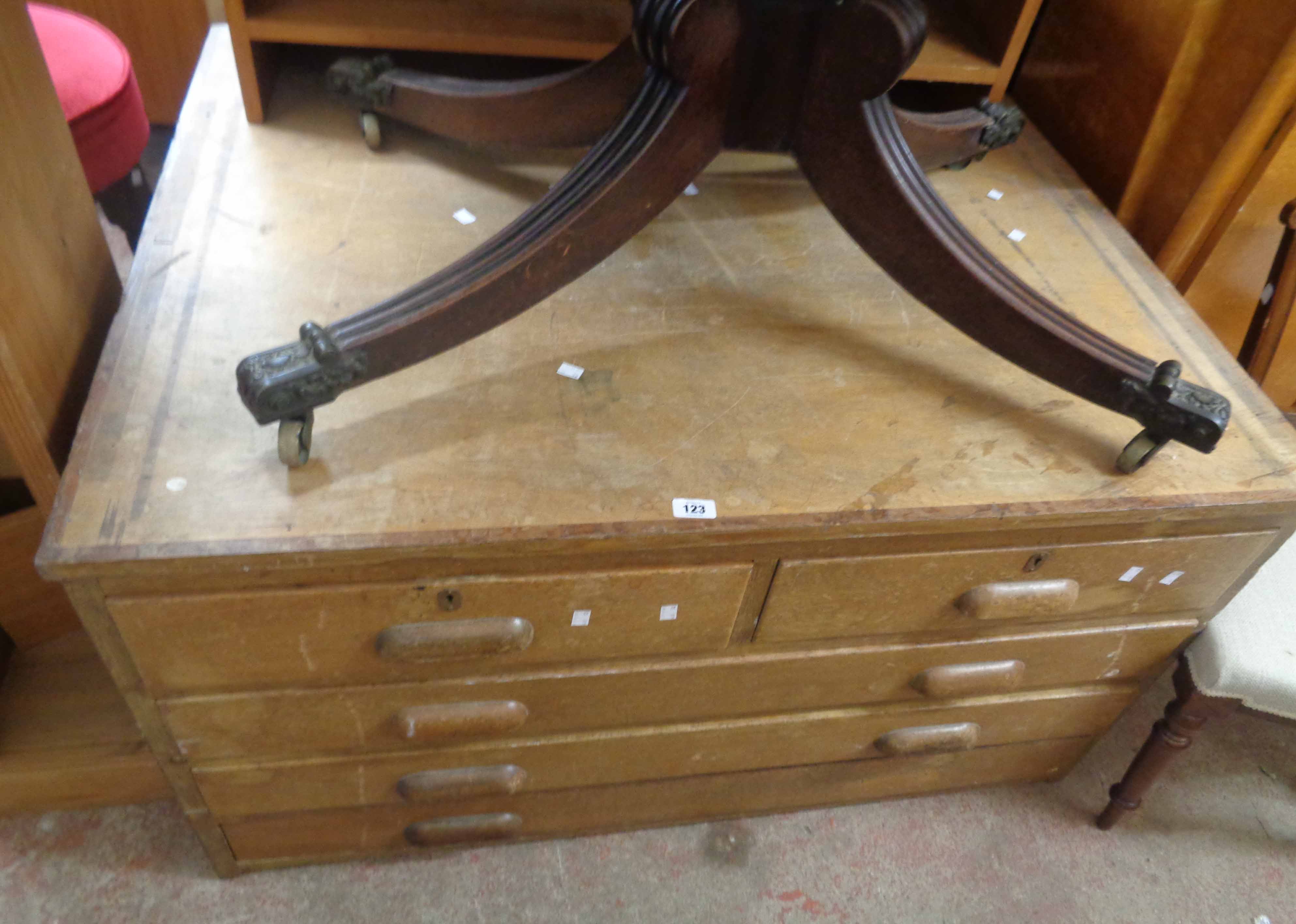 A 1.22m vintage mixed wood plan chest with two short and three long drawers, each with cup handles