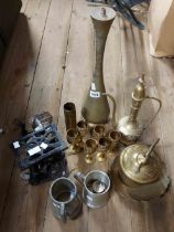 A large quantity of metalware including chased brass Middle Eastern coffee pot and lamp converted
