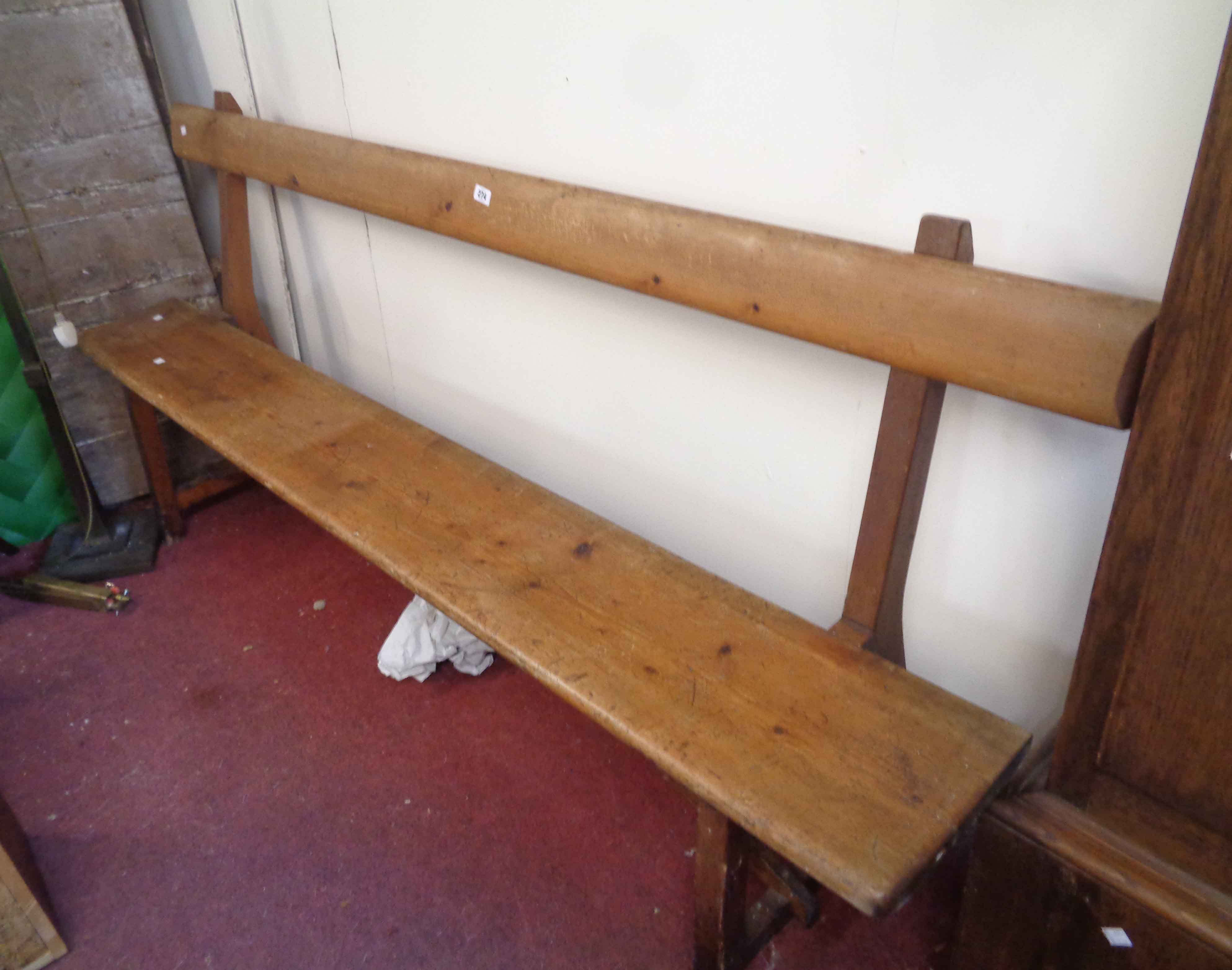 A 2.1m Victorian pine form style chapel pew with book rest to back and moulded solid seat, set on