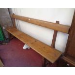 A 2.1m Victorian pine form style chapel pew with book rest to back and moulded solid seat, set on