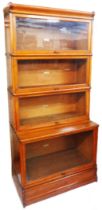 An 86cm early 20th Century Globe Wernicke light oak four section modular bookcase with cornice and