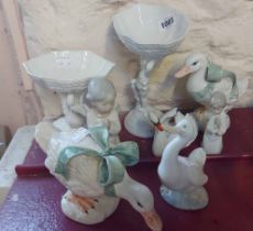 A small selection of ceramics including a Lladro angel figurine, figural shell comports, etc.