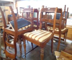A set of eight 19th Century mahogany and strung ladder back dining chairs with upholstered drop-in