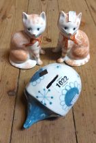 A pair of Rye Pottery cat figurines - sold with a David Sharp Rye pottery money box of hedgehog