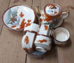 A Japanese late Satsuma part tea set including teapot, cups and saucers, etc.