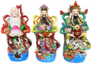 A set of three 20th Century Chinese porcelain deity figures, each depicted standing on a watery base