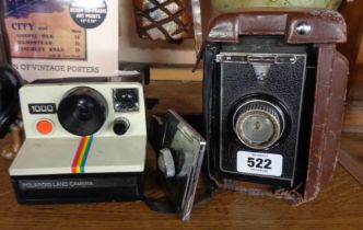 A vintage Polaroid Land Camera - sold with an old Shanghai box camera and detachable handle