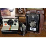 A vintage Polaroid Land Camera - sold with an old Shanghai box camera and detachable handle