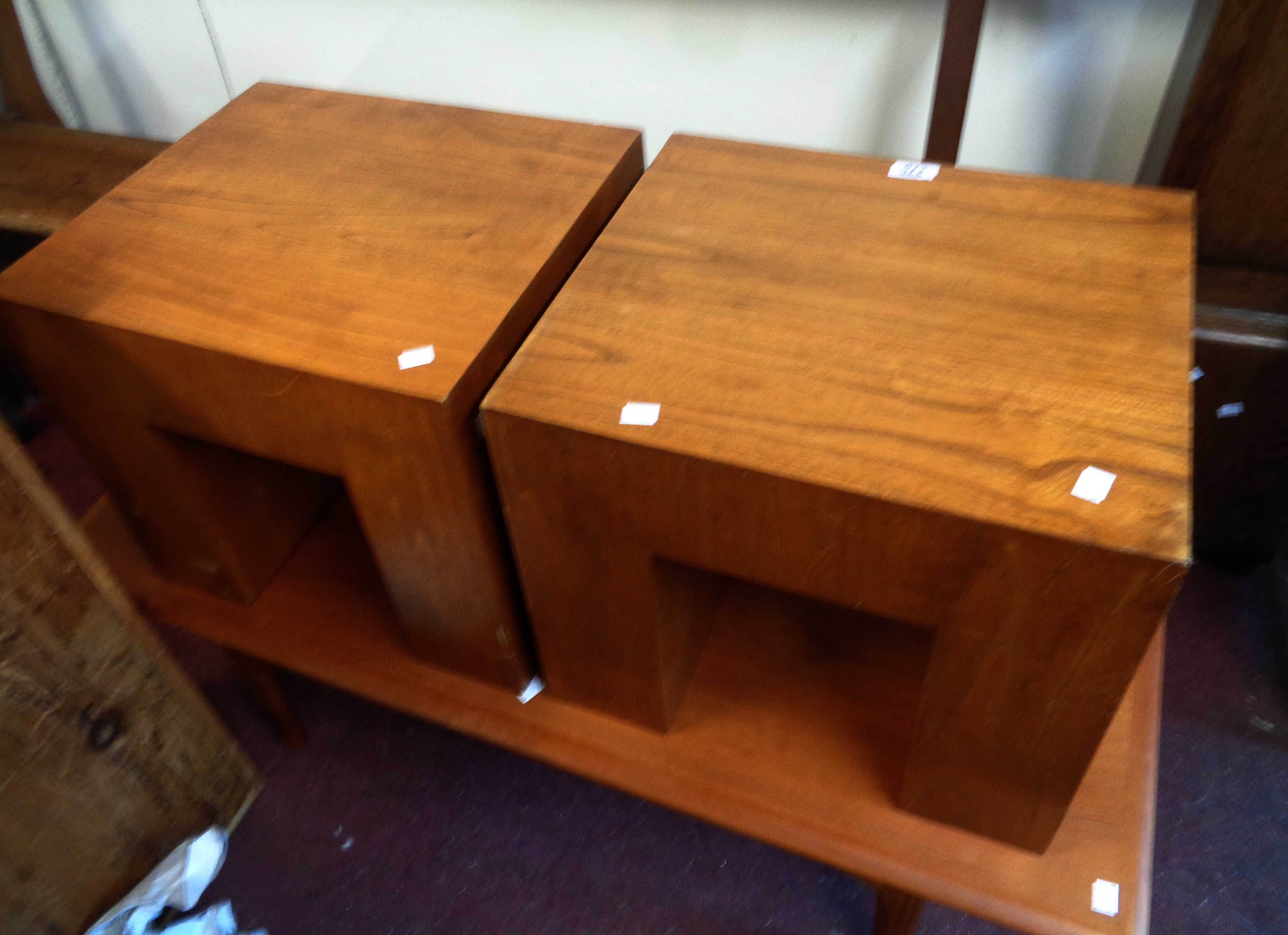 Two similar mid 20th Century tea tables of square block form - retailed by Heals