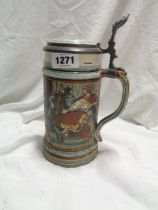 A vintage Villeroy & Boch Mettlach tankard with medieval style frieze decoration and cast metal
