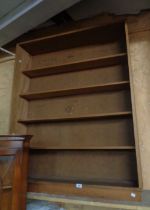 A 1.07m modern mixed wood five shelf open bookcase, set on plinth base