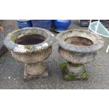 Two concrete urn form planters