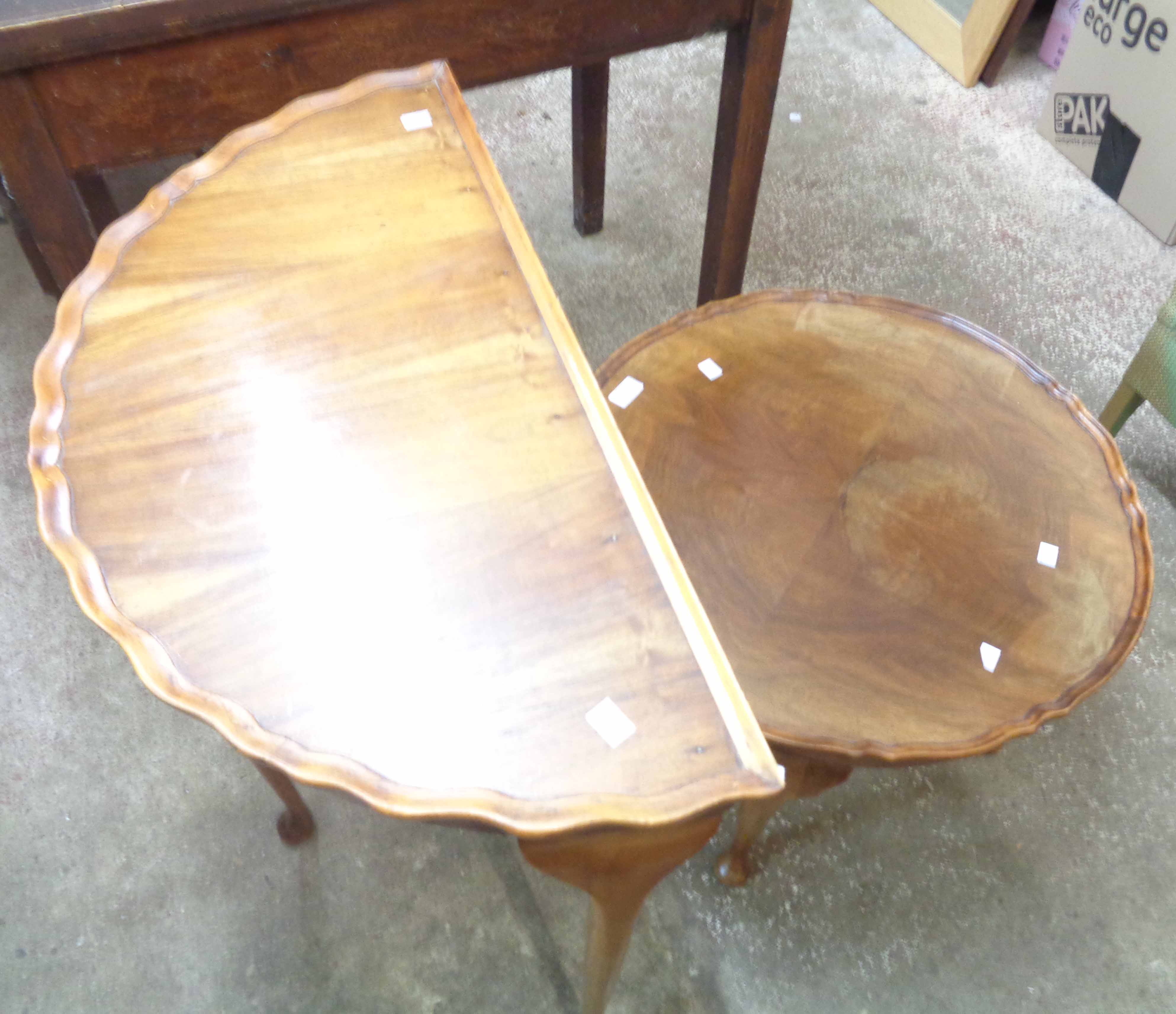 A 73cm reproduction walnut veneered demi-lune side table - sold with a similar tea table