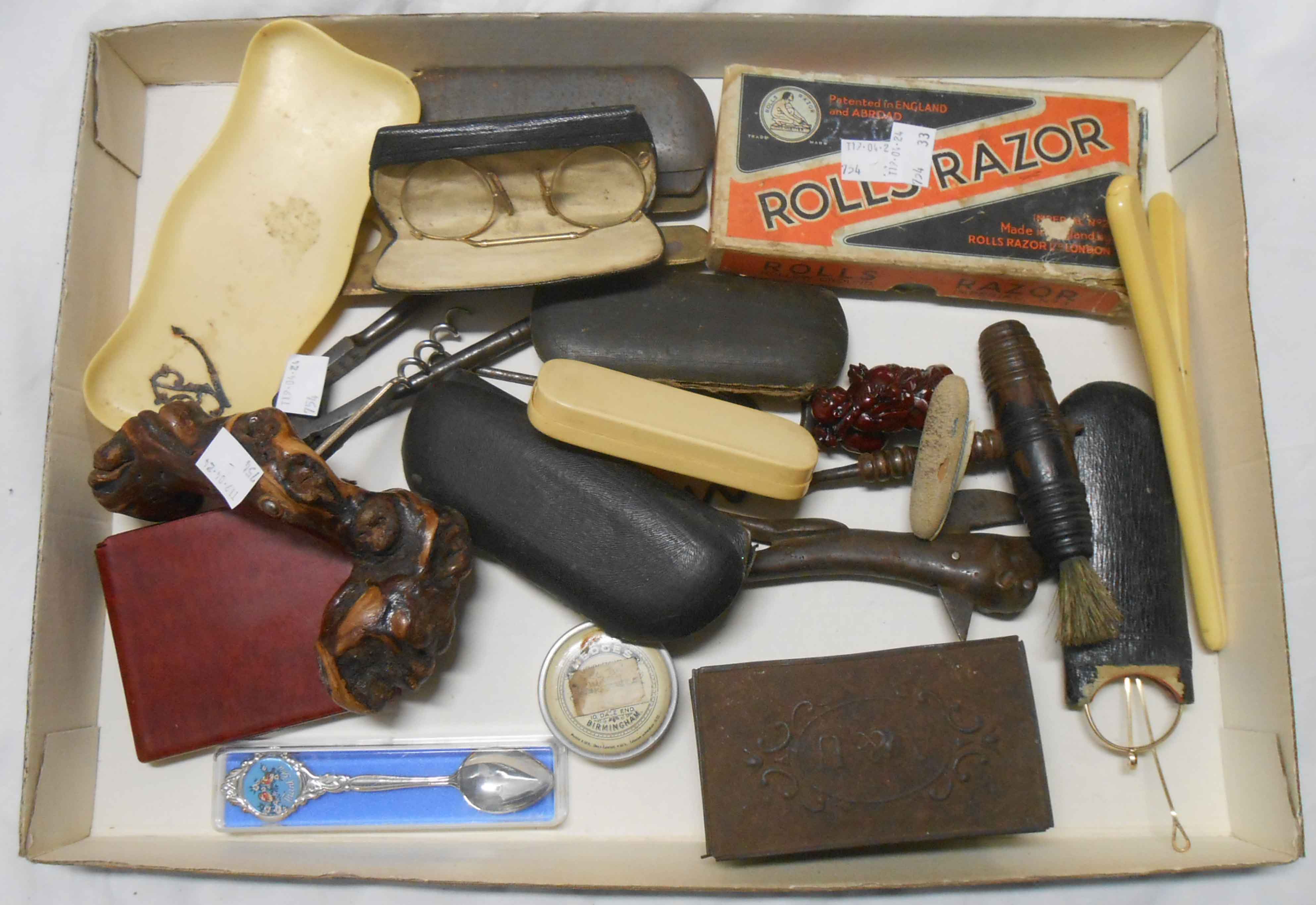 A tray of collectables including corkscrew, an old razor, various cased spectacles, etc.