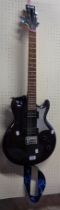 An Ibanez Gio GAX07LTD electric guitar with AX body, purple finish, lizard motif and mirrored pick