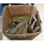 A box containing a quantity of decorative metal figurines including peacock, bull, horses, etc.