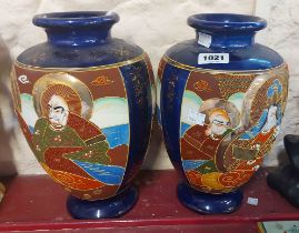 A pair of Japanese late Satsuma vases with moriage decoration on a blue ground