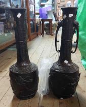 A pair of old Chinese bronze vases with dragon decoration and elephant form handles - one with