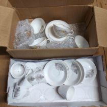 A box containing a vintage Hutschenreuther porcelain part coffee set and another similar