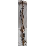 An old African animal hide whip - sold with another similar bound leather whip