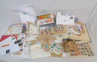 A collection of 20th Century stamps hinge mounted in albums, loose and on paper