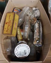 A box containing a quantity of old bottles, advertising tins, etc.