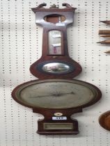 A 19th Century mahogany cased banjo barometer/thermometer with silvered scale and dial, central