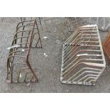 Two vintage metal hay racks