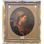 A gilt framed and oval slipped late 19th Century oil on canvas profile portrait of an Eastern