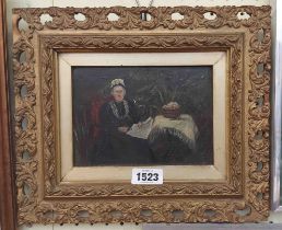 An ornate gilt framed late 19th Century oil on board, depicting a seated lady reading next to a