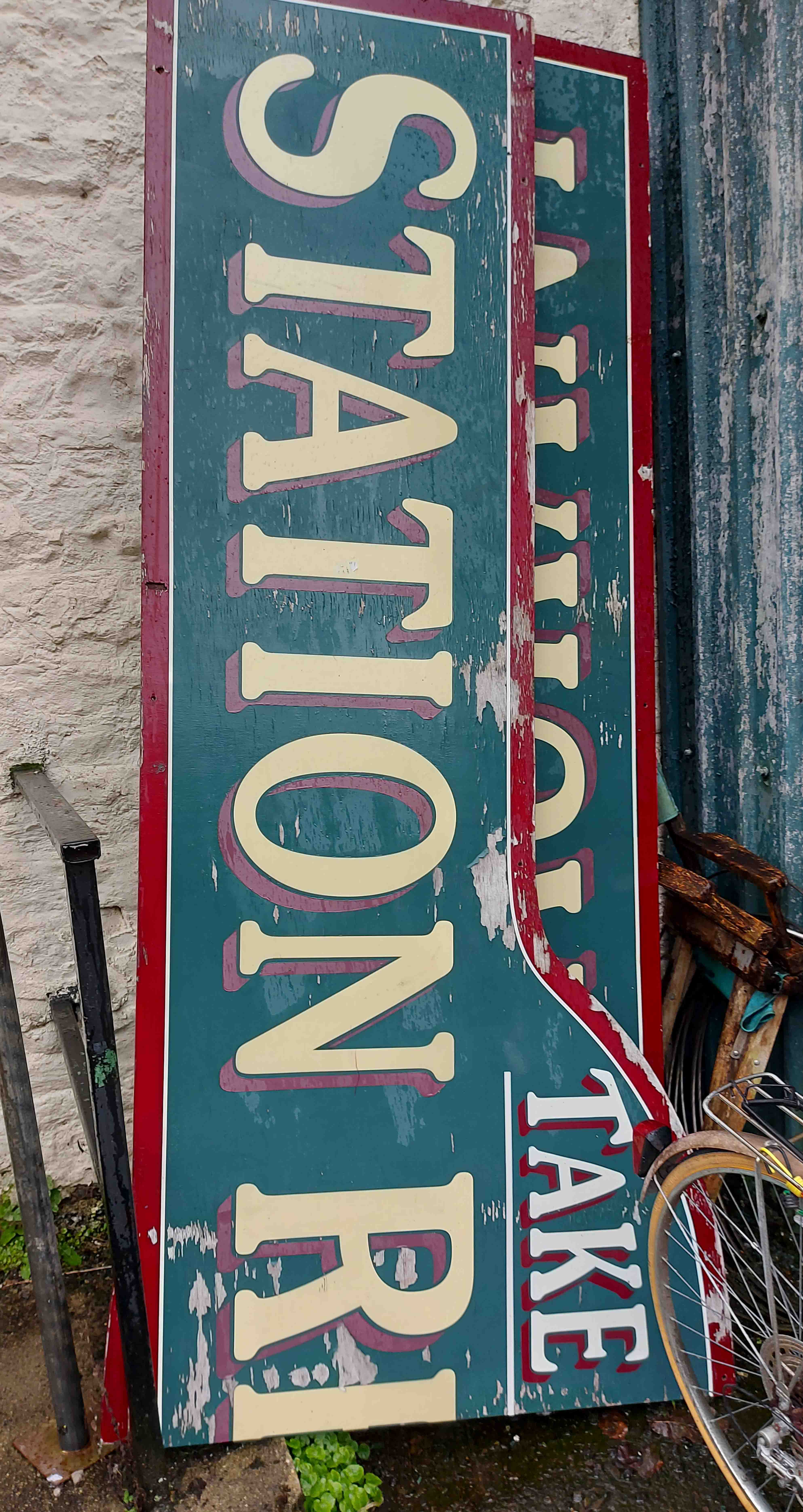 A large painted wood two part 'Station Restaurant' sign - 4.9m overall length