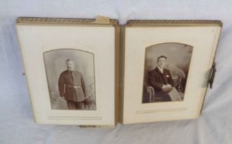 A Victorian photograph album containing cartes de visite, posed family and individual images, a