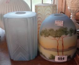 Three vintage opaque glass lamp shades including a landscape decorated example