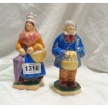 A pair of vintage French Normandie pottery figures, depicting a peasant man and woman off to market