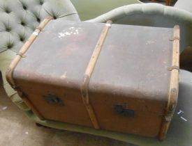A large vintage canvas bound steamer trunk