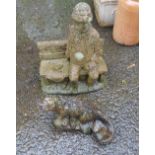 Two stone garden ornaments one depicting an otter, the other a man seated upon a bench