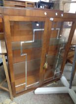 A 90cm 1930's Art Deco walnut veneered break top display cabinet with frosted glass shelves enclosed