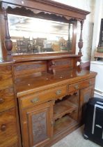 A 1.5m Edwardian stained and carved walnut two part sideboard with bevelled oblong mirror back,